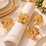 Encante sua mesa posta com o Porta-Guardanapos Rosa Imperial. Design floral com brilho delicado. Kits de 6 ou 12 peças em dourado, prata e rosé gold.